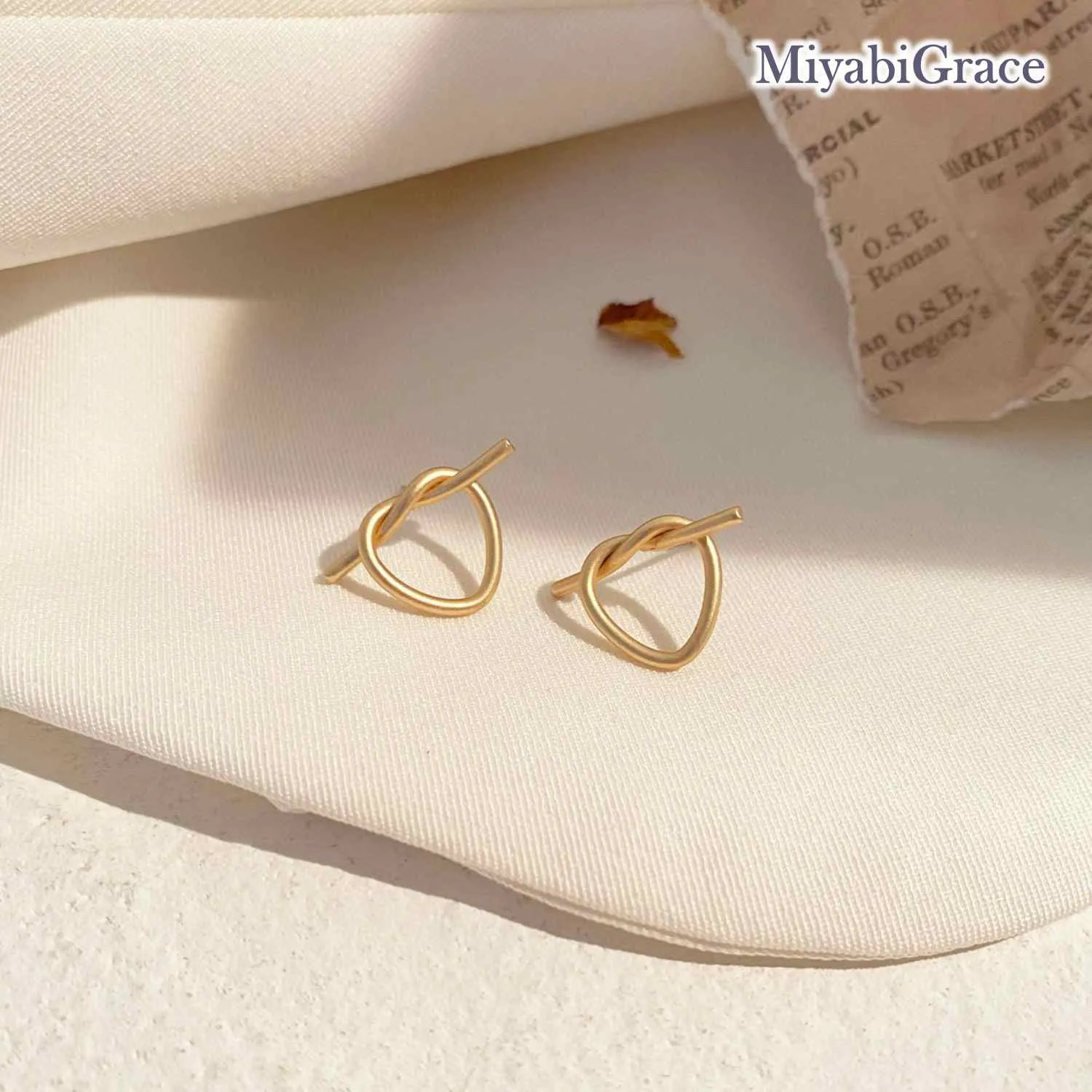 Gold Knot Heart Invisible Clip On Stud Earrings