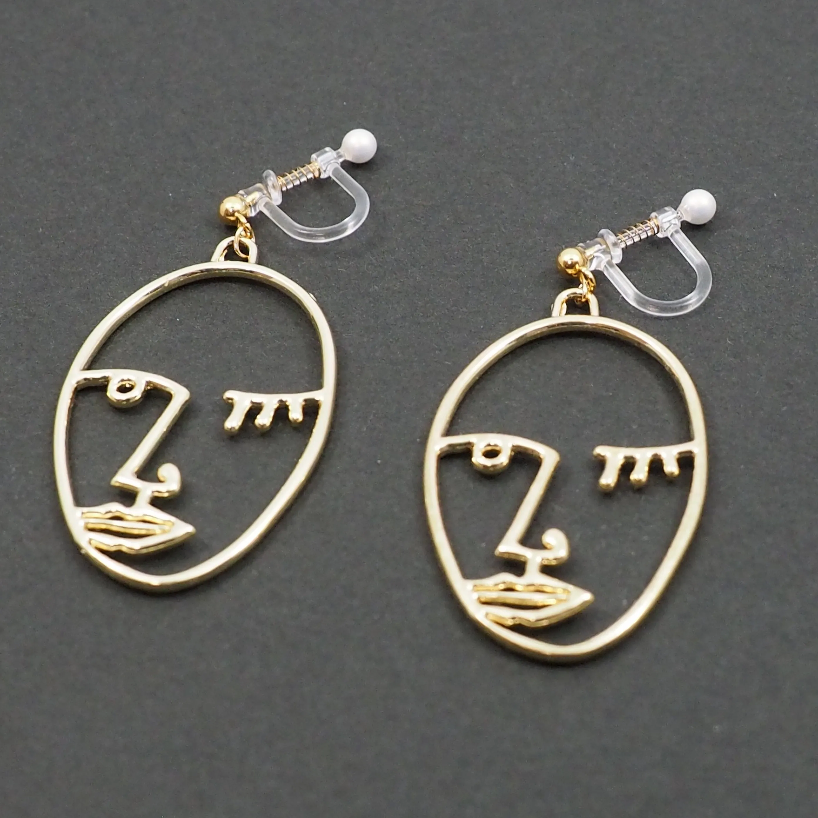 Gold Picasso Face Wink Invisible Clip On Earrings