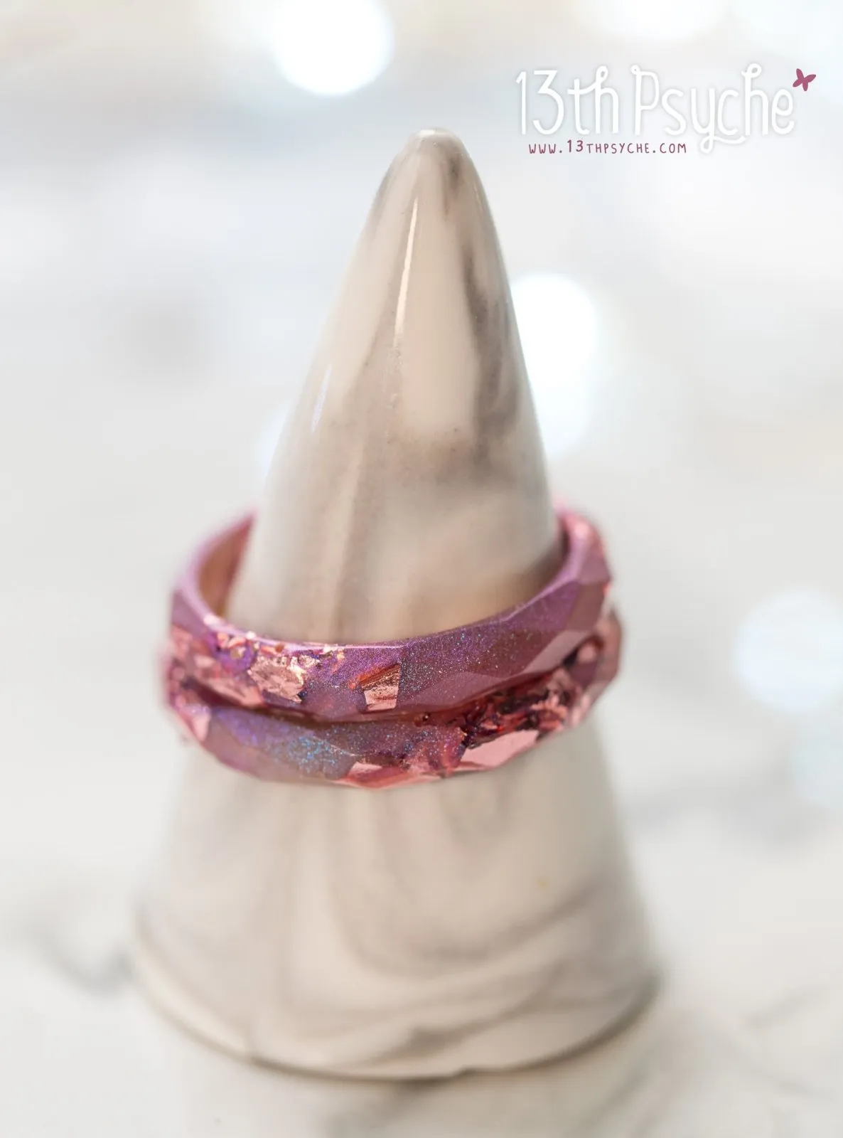 Iridescent pink faceted resin ring with pink metal flakes