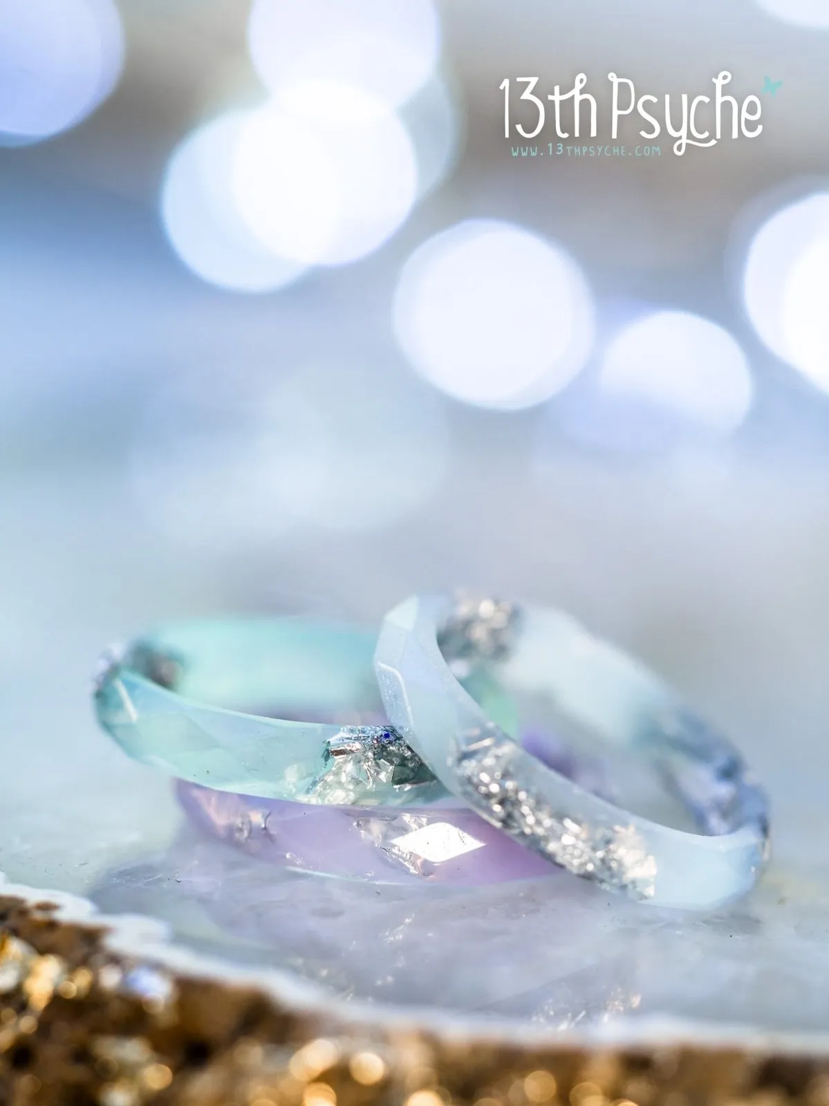 Pastel blue faceted resin ring with silver flakes